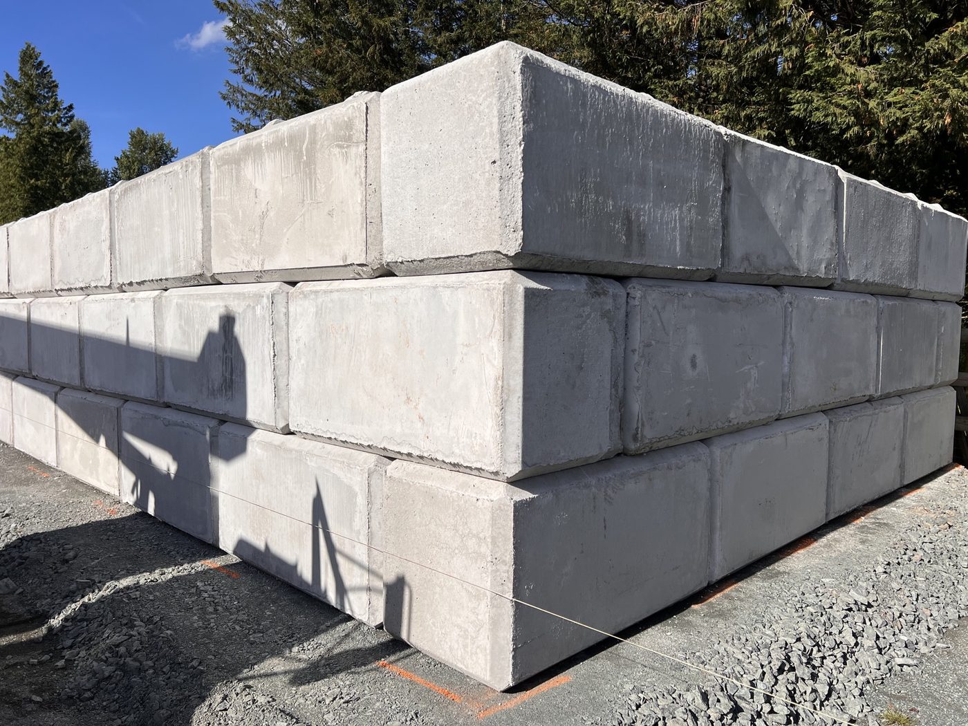 Interlocking concrete blocks stacked and ready on site